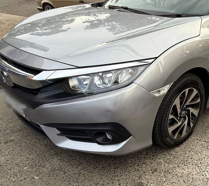 Same Honda Civic with fender fully repaired and repainted