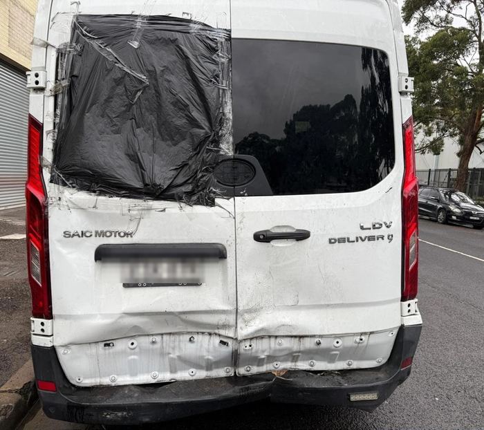 LDV Deliver 9 van with crushed rear doors and bumper before repair